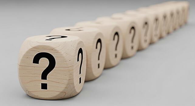Wooden dice displaying question marks in a row on a neutral background representing uncertainty problemsolving and the search for answers in business education and personal development contexts photo