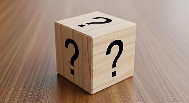 Wooden cube displaying question marks on a wooden surface representing uncertainty and mystery creating a sense of curiosity and intrigue ideal for educational or problemsolving concepts photo