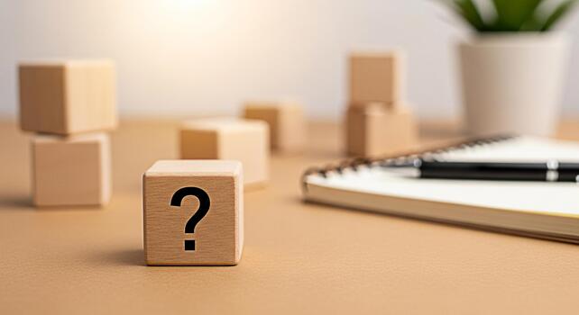 Wooden cube displaying a question mark sitting on a desk with a notebook and pen representing uncertainty and the need for answers in a business or educational setting creating a thoughtful mood photo