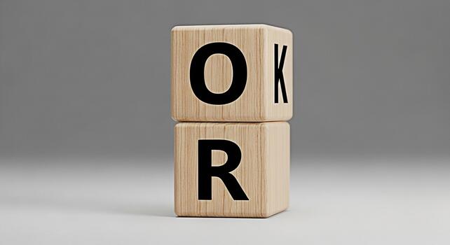 Wooden blocks spelling OK and R stacked in a studio setting symbolizing agreement approval and positive feedback conveying a message of acceptance and correctness with a minimalist aesthetic photo