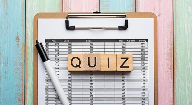 Wooden blocks spelling QUIZ on a clipboard with a spreadsheet and pen on a colorful wooden table representing knowledge assessment and educational challenges in a vibrant setting photo