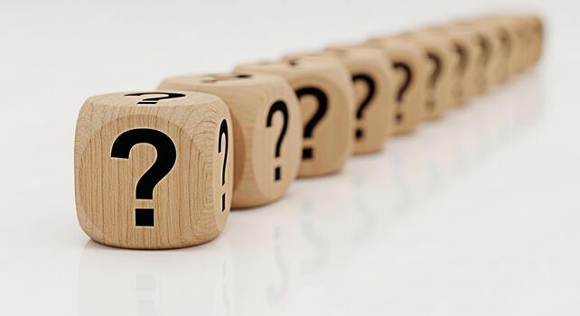 A row of wooden dice displaying question marks on a white reflective surface symbolizing uncertainty and the need for answers in a clean minimalist environment evoking curiosity and problemsolving photo