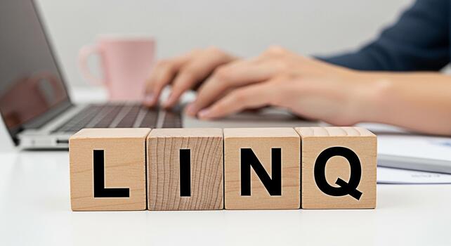 persona mecanografía en un ordenador portátil con de madera bloques ortografía linq en un blanco escritorio simbolizando conexión y tecnología en un moderno espacio de trabajo promoviendo colaboración y innovación con un limpiar minimalista ae foto