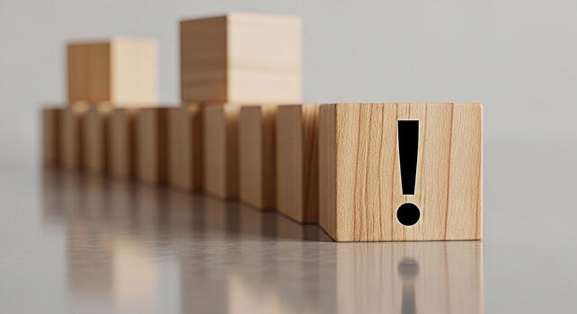 Wooden block with exclamation mark standing out in a row on a reflective surface symbolizing warning attention and the importance of problemsolving in a clean minimalist environment photo