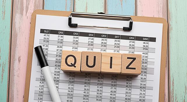 Quiz concept on a clipboard with financial data wooden blocks spelling quiz marker on a rustic wooden table symbolizing education testing knowledge and assessment in a playful learning environment photo