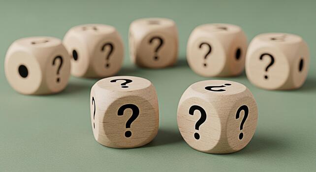 Wooden dice displaying question marks on a green surface representing uncertainty and the need for solutions in a business or personal context creating a sense of mystery and intrigue photo