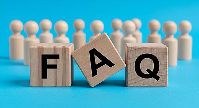 Wooden blocks spelling FAQ on a blue surface with blurred figures in the background representing frequently asked questions and providing answers in a clear and concise manner conveying simplicity and photo