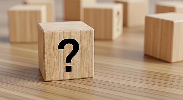 Wooden cube displaying a question mark on a wooden surface surrounded by other cubes representing uncertainty and the need for solutions in a business or educational setting creating a sense of inquir photo