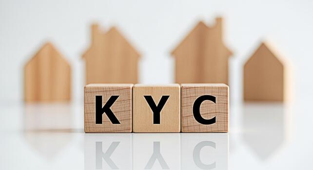Wooden blocks displaying KYC on a reflective surface with blurred house shapes in the background symbolizing identity verification for real estate and financial security in a modern setting photo