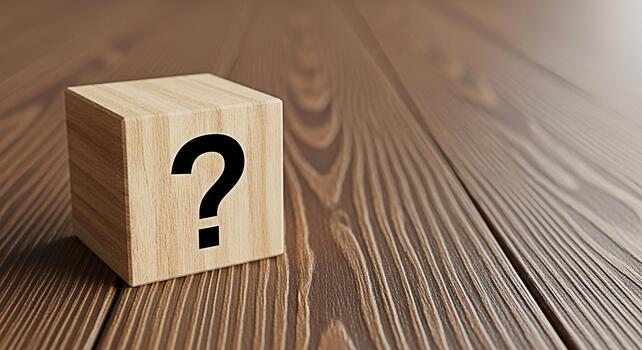Wooden cube displaying a question mark on a rustic wooden surface evoking curiosity and uncertainty about the future and the need for problemsolving and decisionmaking in a natural setting photo