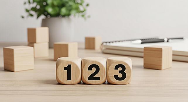 Wooden number blocks displaying 1 2 and 3 on a light wood desk in a bright minimalist office setting symbolizing learning growth and foundational concepts with a clean and organized aesthetic photo