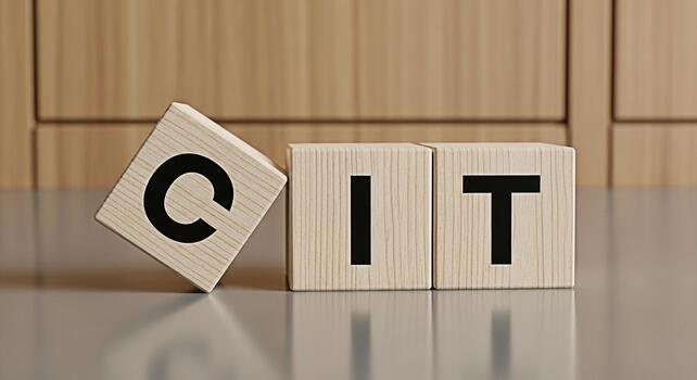 Wooden blocks spelling out CIT on a reflective surface in a studio environment symbolizing technology innovation and the importance of communication in the modern digital age photo