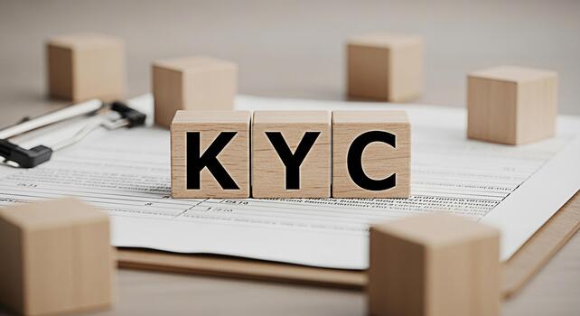 Wooden blocks displaying KYC on a form emphasizing regulatory compliance in a financial setting representing trust and security in banking and investment services photo