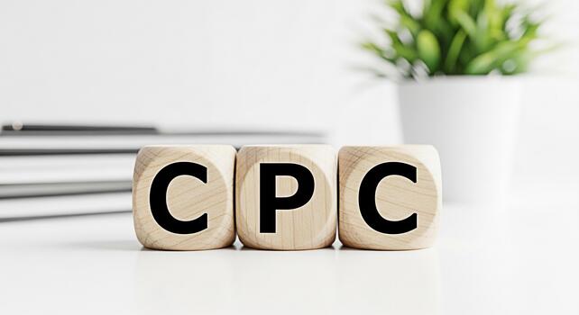Wooden blocks displaying CPC on a white table symbolizing cost per click advertising in a clean modern office environment representing effective online marketing strategies and business growth photo