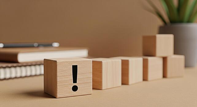 Wooden block displaying an exclamation point on a desk with a minimalist aesthetic symbolizing urgency and attention to detail in a calm organized workspace promoting focus and problemsolving photo