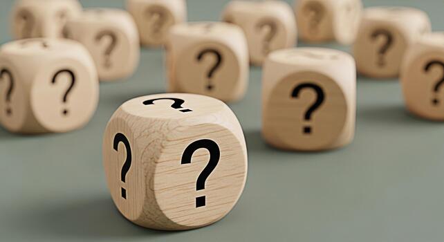 Wooden dice displaying question marks on a neutral background symbolizing uncertainty and the need for answers in business education and personal life creating a sense of curiosity and exploration photo