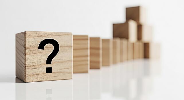 Wooden block displaying a question mark standing out from a row of dominoes on a white surface symbolizing uncertainty problemsolving and the search for answers in a minimalist and conceptual setting photo