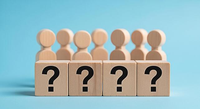 Wooden figures standing behind question mark blocks on a blue surface representing uncertainty and the need for answers in business education and personal life creating a sense of curiosity photo