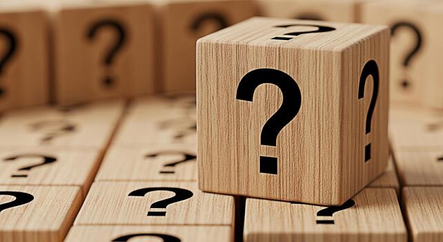 Wooden cubes displaying question marks in a conceptual arrangement symbolizing uncertainty and inquiry set against a blurred background evoking curiosity and the search for answers in a thoughtful com photo