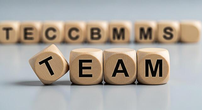 de madera bloques ortografía equipo en un gris superficie simbolizando colaboración y unidad en un negocio ambiente Fomentando un sentido de trabajo en equipo y compartido metas para éxito y logro en el lugar de trabajo foto