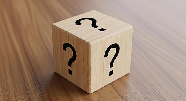 Wooden cube displaying question marks on a wooden surface representing uncertainty and the need for answers in a simple minimalist and conceptual composition creating a sense of curiosity and inquiry photo