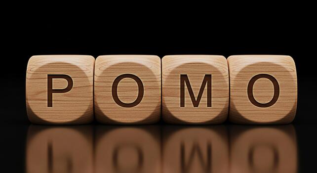 Wooden blocks spelling POMO on a reflective black surface representing a modern approach to productivity and time management fostering focus and efficiency in a minimalist setting photo