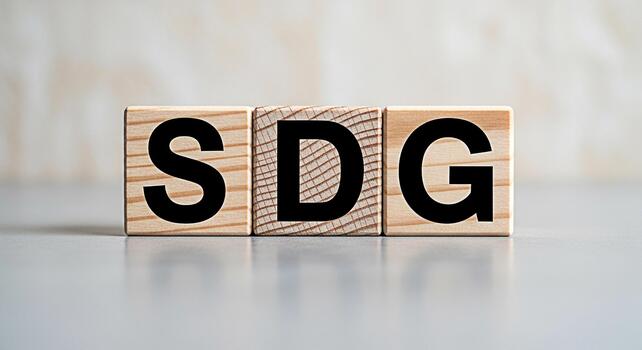 SDG letters on wooden blocks representing Sustainable Development Goals displayed on a neutral surface symbolizing global partnership and commitment to achieving a better and more sustainable future f photo