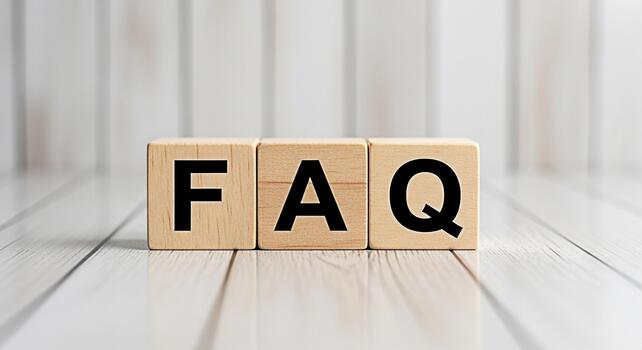 Wooden blocks displaying FAQ on a white wooden surface representing frequently asked questions and information creating a clear and informative atmosphere for customer support and online resources photo