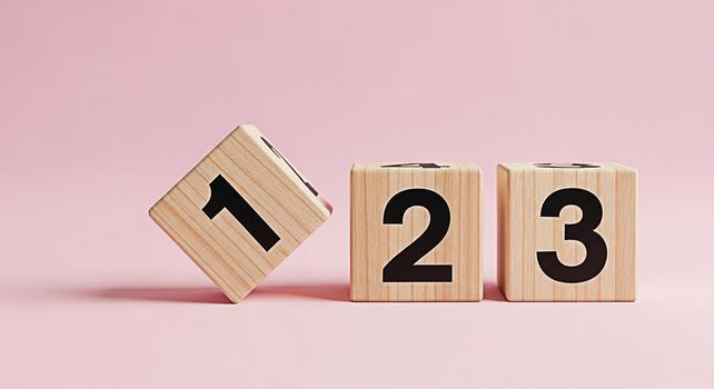 Wooden blocks displaying numbers on a pink surface representing counting and learning symbolizing education and early childhood development in a playful and minimalist setting photo