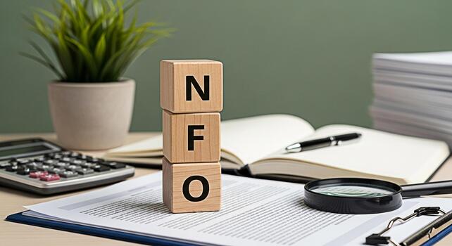 Wooden blocks displaying NFO on a desk with financial documents calculator and magnifying glass symbolizing new fund offer analysis and investment opportunities in a professional setting photo
