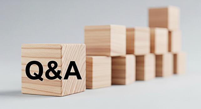 Wooden blocks displaying QA in a minimalist studio setting symbolizing knowledge learning and problemsolving with a focus on questions and answers fostering a sense of clarity and understanding photo