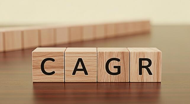 CAGR letters on wooden blocks sitting on a table representing compound annual growth rate a key performance indicator in a financial and investment planning environment showing growth and success photo