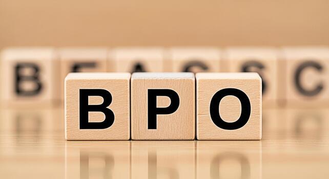 Wooden blocks spelling BPO on a reflective surface symbolizing business process outsourcing in a clean and minimalist setting conveying professionalism and efficiency in business operations photo