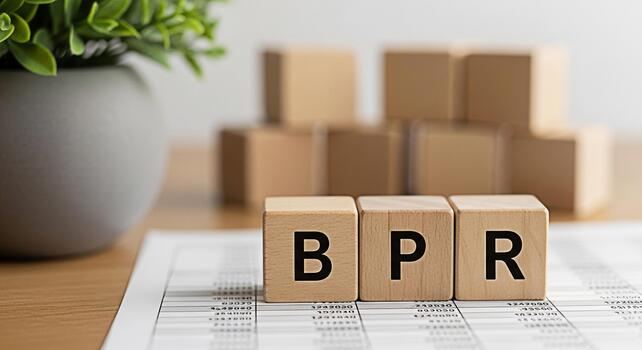 Wooden blocks spelling BPR on a financial report in a bright office representing Business Process Reengineering and creating a focused and efficient business strategy for success and growth photo