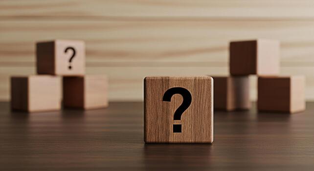 Wooden blocks displaying question marks on a dark wooden table against a light wood background representing uncertainty problemsolving and the search for answers in business and personal life photo