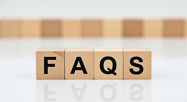 Wooden blocks spelling FAQs on a white surface representing frequently asked questions in a clean minimalist setting conveying clarity and information for customer support and online resources photo