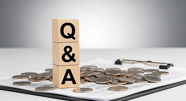 Wooden blocks displaying QA on a financial report with coins symbolizing questions and answers about money matters in a bright office environment representing financial literacy and investment decisio photo