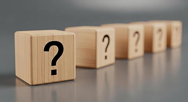 Wooden blocks displaying question marks in a row on a gray surface symbolizing uncertainty and the need for answers creating a mood of curiosity and problemsolving photo