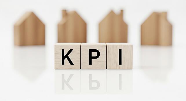 Wooden blocks displaying KPI in a bright setting symbolizing key performance indicators for real estate success and property management creating a concept of measurement and achievement in the housing photo