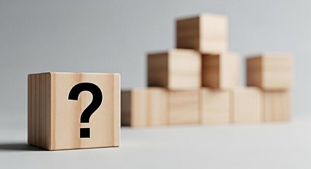 Wooden block displaying a question mark in a minimalist studio setting symbolizing uncertainty and the need for answers fostering curiosity and problemsolving skills in educational contexts photo