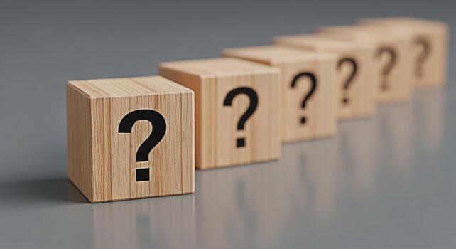 Wooden blocks displaying question marks in a row on a gray surface symbolizing uncertainty and the need for answers creating a mood of inquiry and problemsolving photo