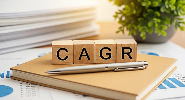 Wooden blocks displaying CAGR on a notebook in a bright office setting representing compound annual growth rate and financial planning for investment success and business growth conveying a sense of o photo