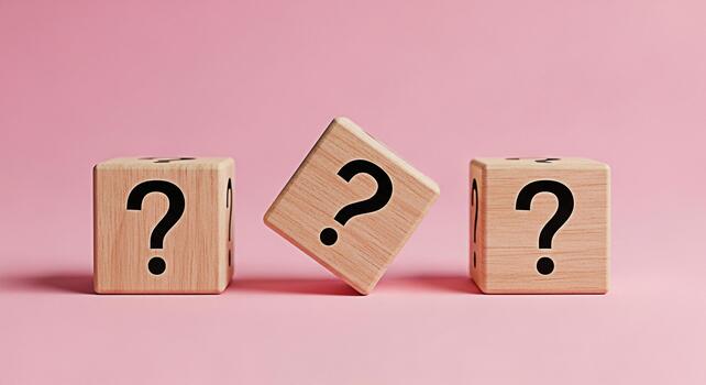 Three wooden blocks displaying question marks on a pink background symbolizing uncertainty and the need for answers creating a sense of curiosity and prompting viewers to seek solutions and explore po photo