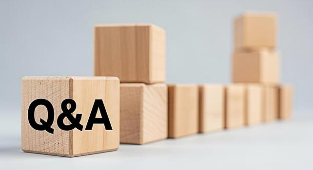 Wooden blocks displaying QA in a bright studio setting representing knowledge learning and problemsolving with a focus on questions and answers for educational and business concepts photo