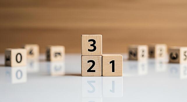 Wooden number blocks stacked on a white surface displaying numbers 1 2 and 3 creating a countdown sequence in a bright and clean environment symbolizing learning and development photo