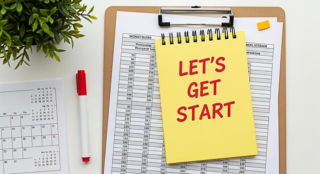 Yellow notepad with Lets Get Start message on a clipboard with financial data calendar pen and plant on a white desk symbolizing motivation and new beginnings in a business environment photo