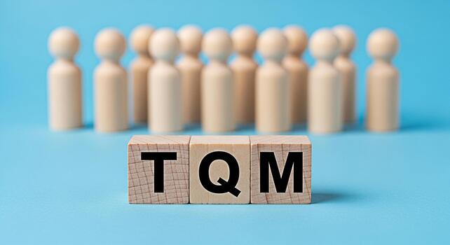 Wooden figures focus on TQM on wooden blocks in a bright blue setting representing a commitment to quality management and continuous improvement within a team or organization photo