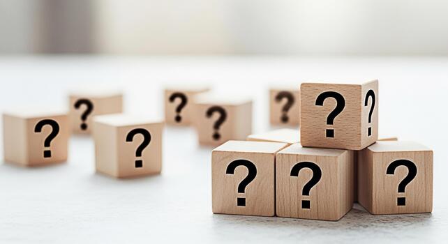 Wooden blocks displaying question marks on a bright surface representing uncertainty and the need for answers in business education and personal life creating a sense of curiosity and inquiry photo
