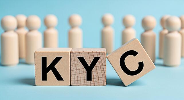 Wooden blocks displaying KYC in a business setting with a group of people representing the concept of compliance identity verification and regulatory requirements in a modern and trustworthy manner photo