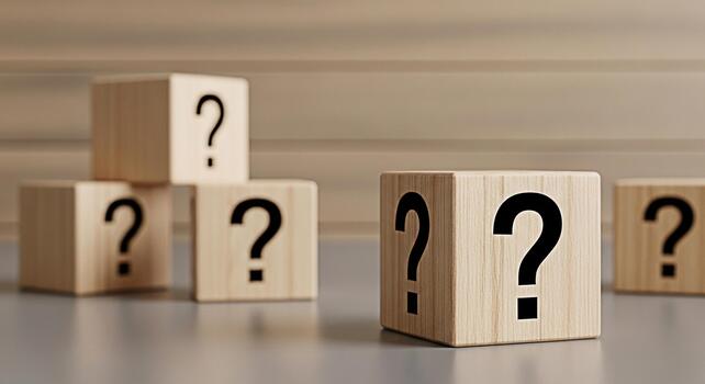 Wooden blocks displaying question marks in a bright studio setting symbolizing uncertainty and the need for answers creating a mood of curiosity and problemsolving photo